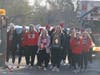 The Mighty Macs take a victory lap Monday morning during a recognition rally to celebrate the girls volleyball team's state championship. 