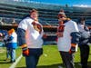 Larry Elitzer (front) and son, Corey, both rabid Chicago Bears fans and former Advocate Christ heart patients, got the experience of the lifetime participating in the Bears pregame ceremony.             