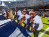 Larry Elitzer (front) and son, Corey, both rabid Chicago Bears fans and former Advocate Christ heart patients, got the experience of the lifetime participating in the Bears pregame ceremony.             