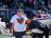 Larry Elitzer (front) and son, Corey, both rabid Chicago Bears fans and former Advocate Christ heart patients, got the experience of the lifetime participating in the Bears pregame ceremony.             