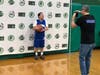 An Oak Lawn Eagle player poses for his "official trading card" photo during media night for the Special Rec All-Star Basketball Games at OLCHS on Jan. 28. 