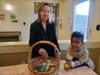 Pamela Ball, a resident of Grace Point Memory Care, and a young friend from Southwest Christian School, show off their Easter basket. 