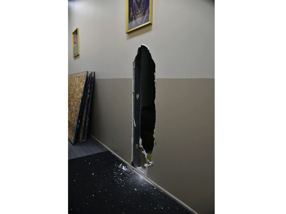 Three men allegedly cut a hole in an empty business and waited for the store owner to come back, police said. 