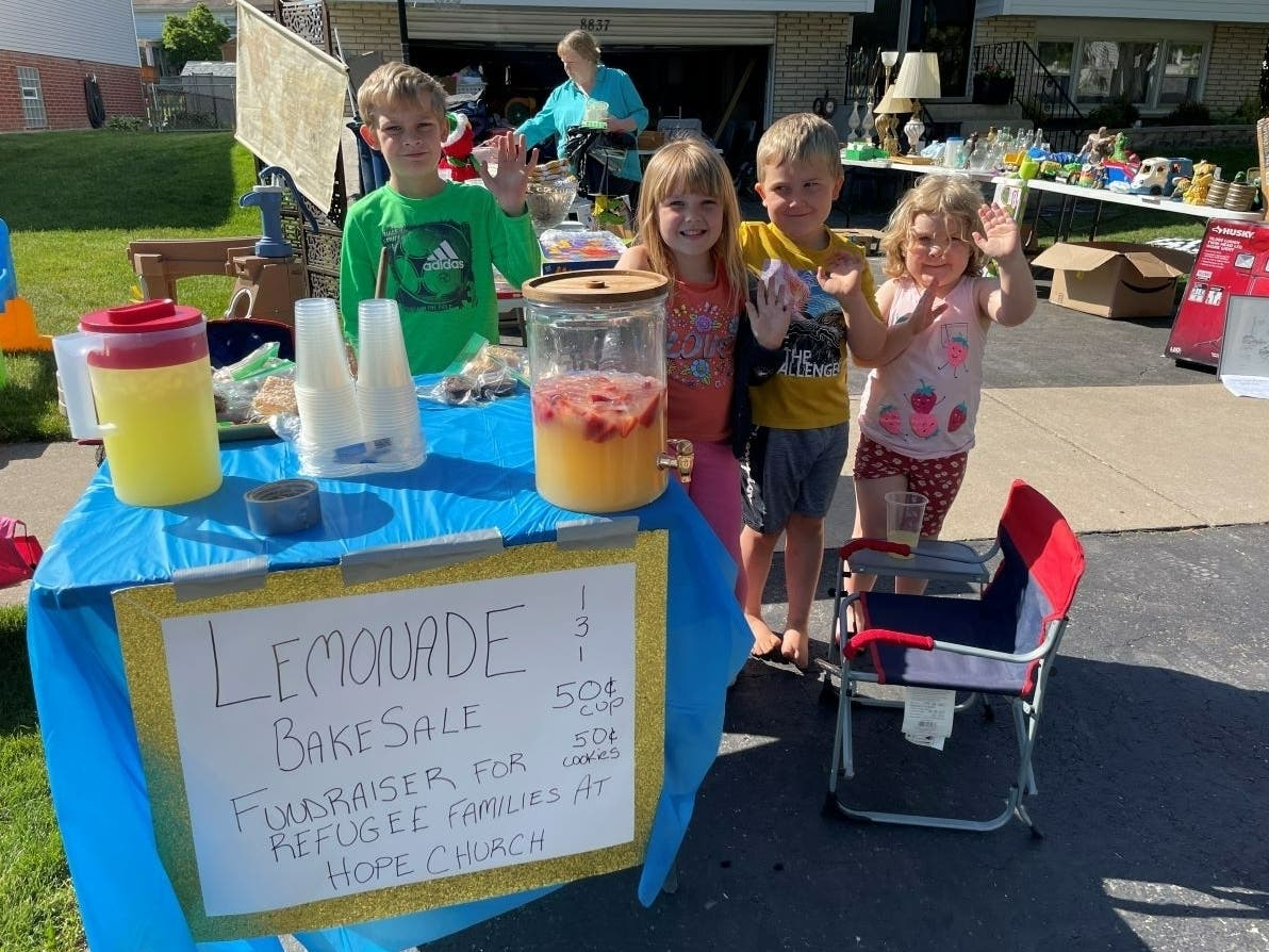 Levi Pettus, 8, Amanda Faryniaz, 5, Noah Pettus, 5, and 3-year-old Lucy Pettus, of Hickory Hills, are selling lemonade and their toys to raise money to help but summer items for migrant children. 