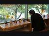 A patron takes in the miniature canvasses at the Oak Lawn Public Library's Tiny Art Show. 