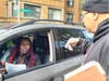 Tio Hardiman, executive director of Violence Interrupters, NFP, distributes fliers for missing 13-year-old Dexter Berry, who has been missing in Chicago's South Shore neighborhood since Oct. 9.