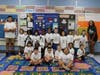 EPCHS students Angel Camacho-Gonzalez and Samanthat Ricks, alumni of Northeast School, distributed "Future Mustangs" to Northeast kindergartners.