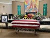 The flag-draped casket of 1st Lt. Edward Timothy McGuire at Most Holy Redeemer Church, who was unidentified for 80 years after he went missing in World War II.