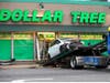 A tow trucks hauls away a car that plowed into Dollar Tree in Oak Lawn. 