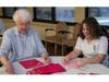 Mercy Circle resident Sister Mary Ann Bergfeld, RSM, and Mother McAuley junior Kathleen Ilarraza, decorate bags for the candy donation to Pat’s Pantry.
