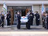 A Chicago police honor guard carries the casket of Officer Luis Huesca out of Blake-Lamb Funeral Home in Oak Lawn. 