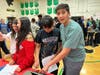 CMS students try out a typewriter. 