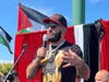 South Side native Belal Muhammad, the first Palestinian to win a UFC championship, address supporters during a victory rall Sunday in Little Palestine. 