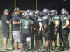 EPCHS Coach Jim Ramazinski (far left) and Assistant Coach Darian Yarborough talk to the offensive line. 