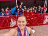 Nora Doyle, head coach of Marist's girls cross-country team, credits her "Marist girls" for supporting her as she trained for the Chicago Marathon