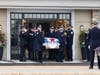 A Chicago police honor guard carries the casket of fallen Officer Enrique Martinez out of Blake-Lamb Funeral Home in Oak Lawn. 