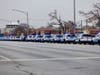 A long line of Chicago police vehicles follows the hearse carrying Officer Enrique Martinez's casket east on 103rd Street to St. Rita for the funeral mass. 