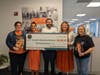 The MuSic Movement board presented a check for $50,000 to the National Multiple Sclerosis Society at the first 
