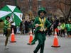 Leprechauns dance a jig on Western Avenue.