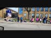 Students wait on the sidewalk in front of St. Christina School, where over 80 percent of the student body are the sons and daughters of Chicago first responders. 