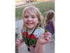Rosie Hiller, 7, of Alsip, shows off the four-leaf clover she found on the first day of spring. 