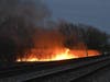 A brush fire rages at 119th Street and Kostner Avenue in Alsip. 