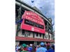 Let's play two: Oak Lawn Community High School and Reavis High School make the marquee at the entrance to Wrigley Field. Earlier the electronic board read "Cubs Win."