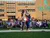 Andrea Zumhagen, a cancer survivor and keynote speaker, hugs relay coordinator Jen Jepsen at the OLCHS Relay for Life event. 
