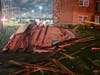 Remains of a roof on the ground after winds blew it off an apartment building in Bridgeview during Thursday's storm 