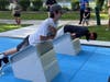 MVCC cross-country team members demonstrate the 7-minute workout on the National Fitness Campaign outdoor fitness court in Palos Park.