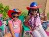 Their grandmother told us they would rather not wear their Fourth of July cowboy hats, but we made them to put them on. 