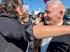 Barbara Mancari gives her father, Frank, founder of the former Mancari Chrysler Dodge Jeep Ram, after a street sign was dedicated in his honor at 95th Street and Kenton Avenue in Oak Lawn. 