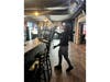 Donte Edwards stacks chairs at Lawlor's Bar in Chicago. The program for young adults with disabilities is currently seeking partners for job training.