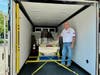 Board member and volunteer driver, Bill Egan, stands by Children's Museum of Oak Lawn's 9-11 World Trade Tower Beams traveling exhibit before leaving for Rochester, NY.