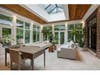 The house in St. Charles offers floor-to-ceiling windows with stunning forested views. 