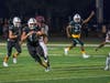 Fullback Jayden Schlosser (44) carries the ball for Oak Lawn Community High School in the season opening blowout against Argo High School.