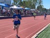 Special Olympians running Track