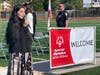 Zoe Havard sings the National Anthem, Chief Swing in the background