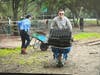 Ryan Jergensen with a big wheelbarrow full