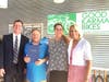 President Matt Stepan (L) and Jenice Condie (R) of The Church of Jesus Christ of Latter-day Saints present grant to JIm Gardner and Jenny Circle of Good Karma
