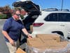 Agencies arrived using their trucks and personal vehicles to distribute the milk.