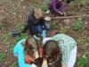modern children planting at St. Michaels Farm Preserve