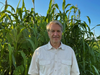 Ed Huling of Soil Conservation Partners, dwarfed by amended crops at St. Michaels Farm Preserve, Hopewell, New Jersey