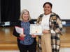 Mercy Baez of Salem (right) accepts the MVHoward Teacher Recognition Award from Dr. Howard.