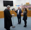 Judge Benz swears in Supervisor Adam Selisker, Hanna holds bible