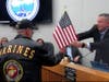 Selisker hands Palestina Glover's US flag