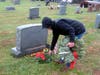 Ron Reilly lays a wreath.