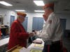 District 2 Vice Commandant Gene Irvin (L) presents the gavel and congratulates Commandant Mike Clark.