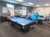 Pete Palestina making a shot while challenger Ron Mokos watches