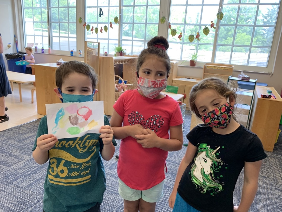 Pictured at the F.M. Kirby Children’s Center of the Madison Area YMCA is Christopher Lyng age 4 from Chatham, Chelsea Arguedas age 5 from Madison, and Riley Koontz age 5 from Madison in their Honeybees preschool classroom showing off an art project.    